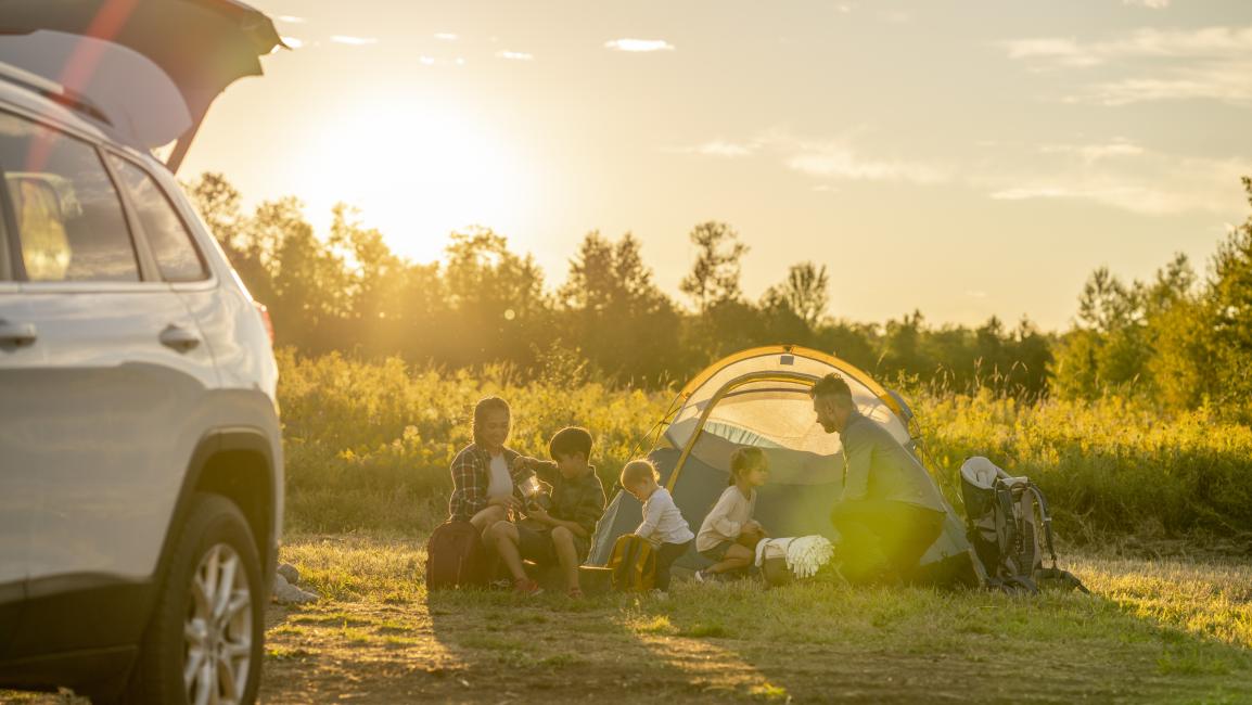 Little kids sitting camping