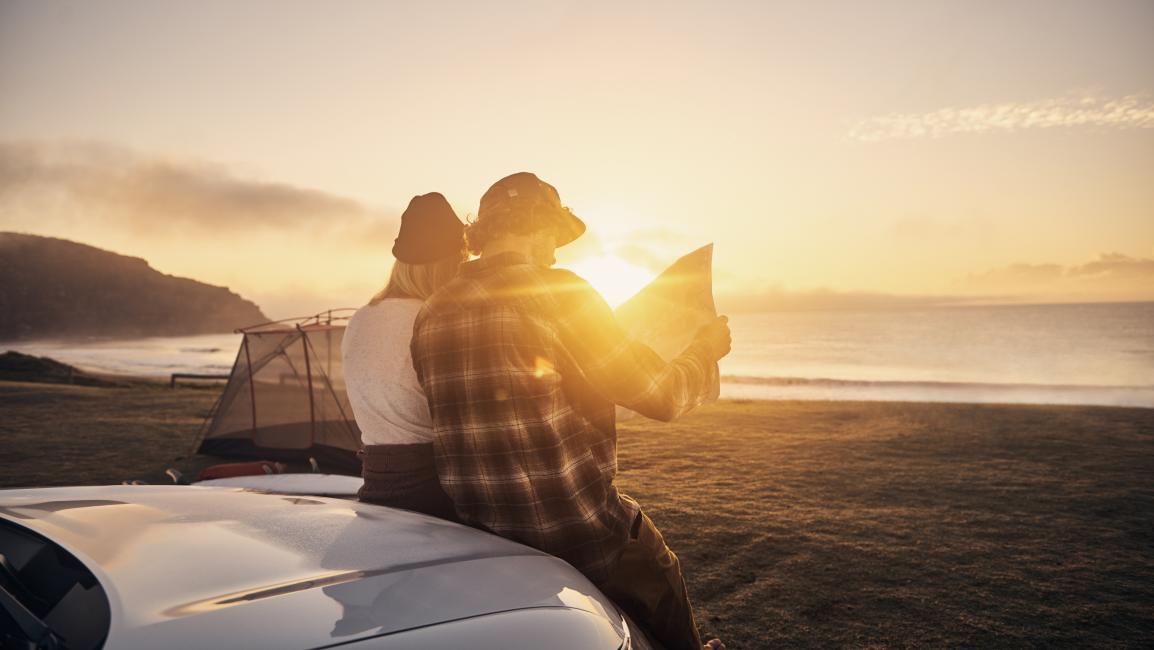 Looking at map in the sunset