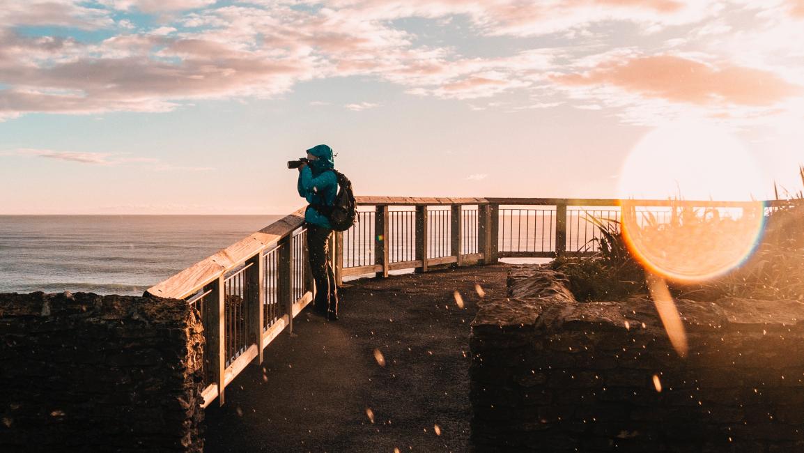 Man taking photo of balcony