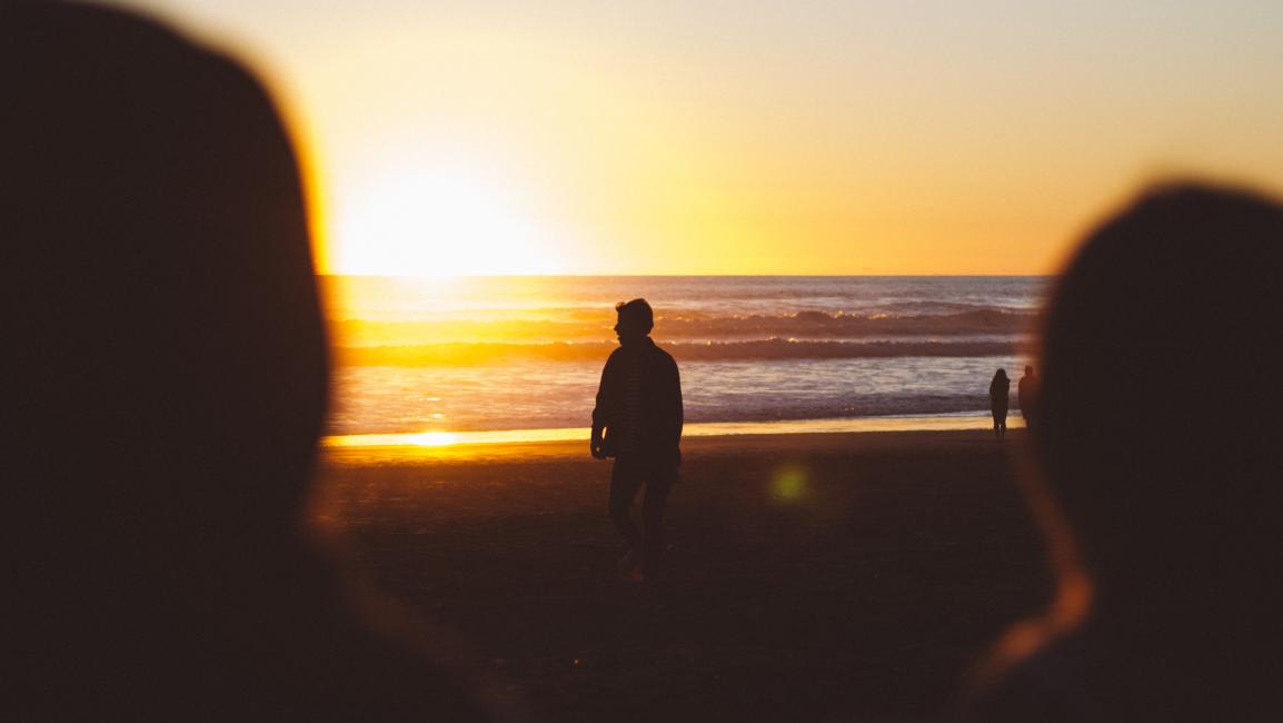 Looking at beach and person